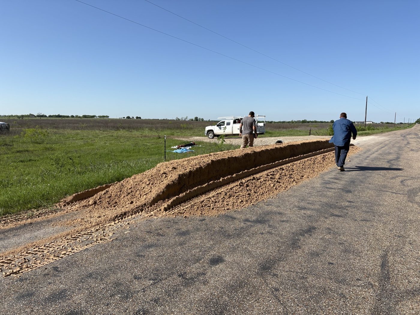 Waterline trench and spoil bank running along Battle Lake Road